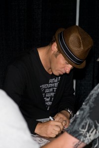 Toby Mac giving an autograph.